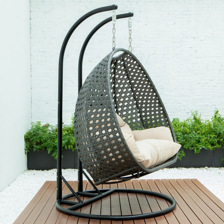 LeisureMod Charcoal Wicker Hanging 2 person Egg Swing Chair Beige Side View.