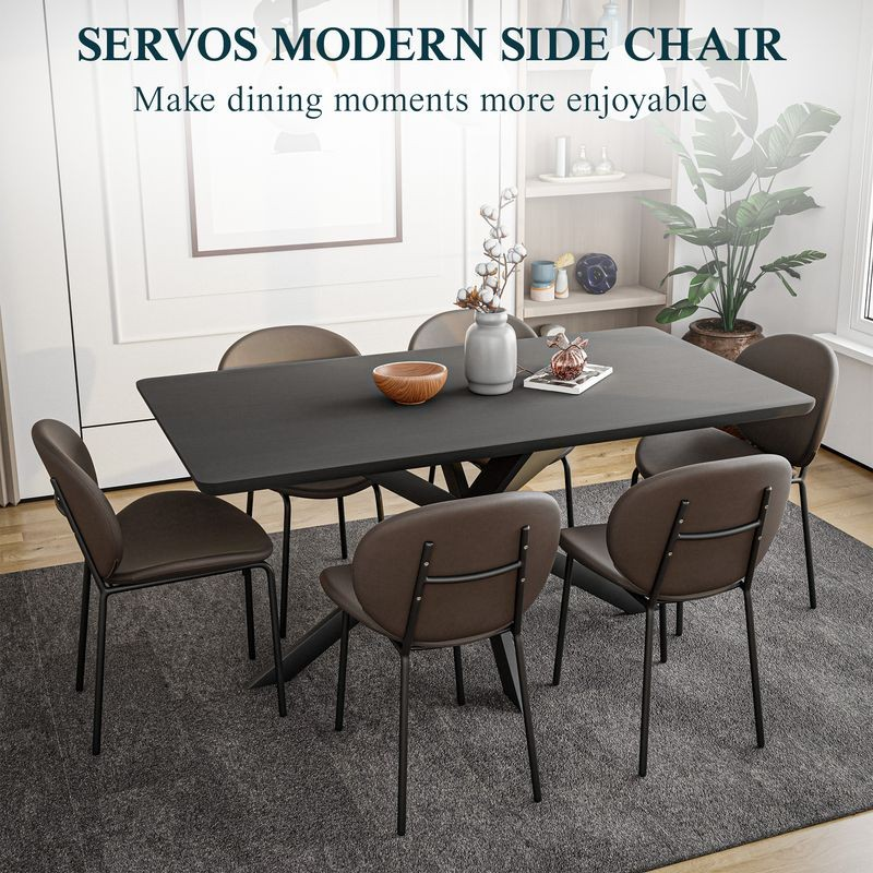 LeisureMod Servos Modern Dining Side Chair with Upholstered Faux Leather Seat and Powder Coated Iron Frame for Kitchen and Dining Room Elephant Grey at Table.