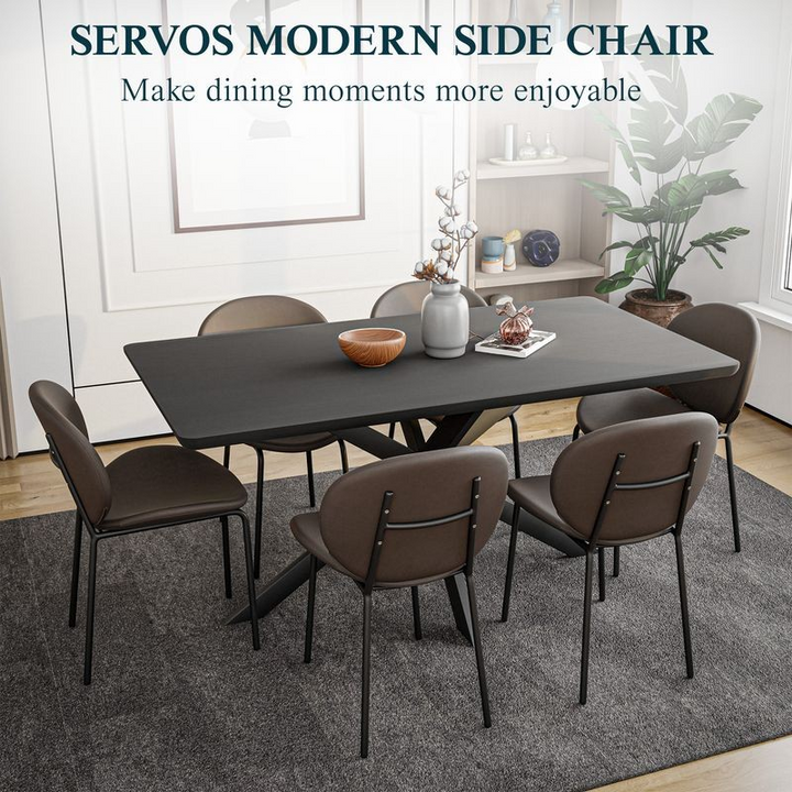 LeisureMod Servos Modern Dining Side Chair with Upholstered Faux Leather Seat and Powder Coated Iron Frame for Kitchen and Dining Room Elephant Grey at Table.