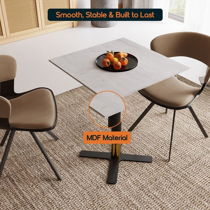 LeisureMod Vail Collection Dining Table Black/Gold X Base With 24" Square Light Wood Brown MDF Top with Details.