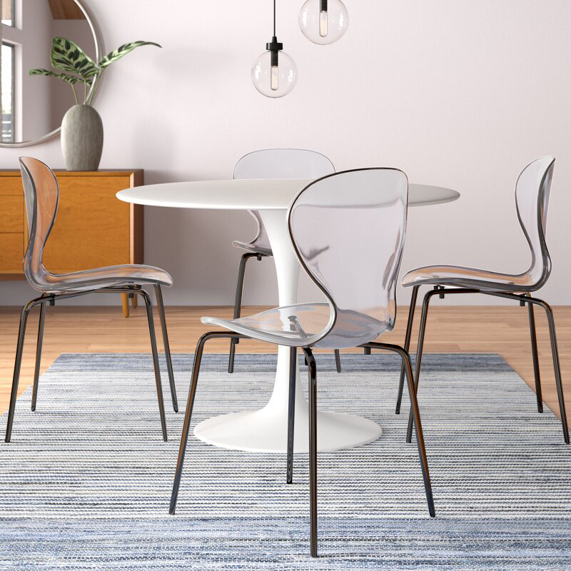 LeisureMod Modern Oyster Transparent Side Chair in Black Base set of 2 Clear at Table.