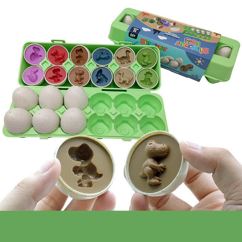 Dinosaur themed mold set with stamps and colored clay in a green carrying case.