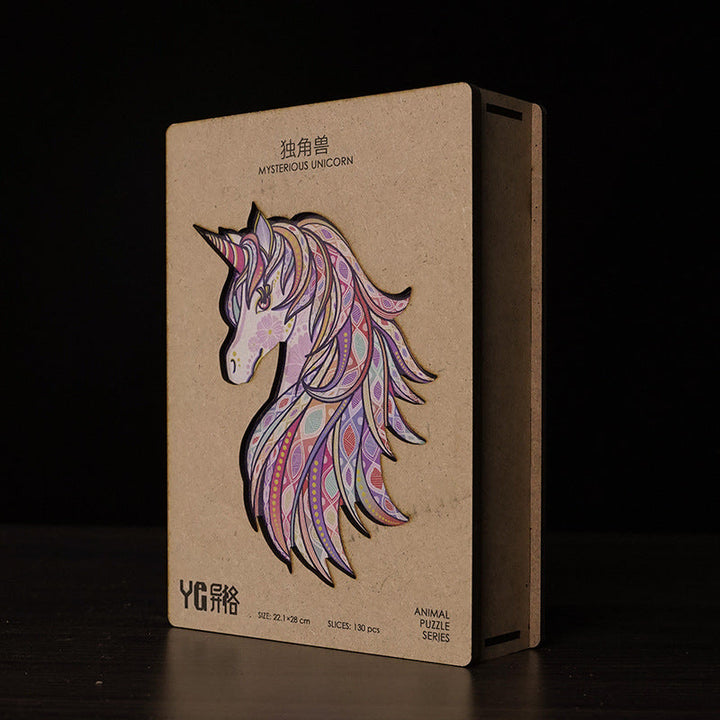 Cardboard packaging with a colorful unicorn design on a dark background.