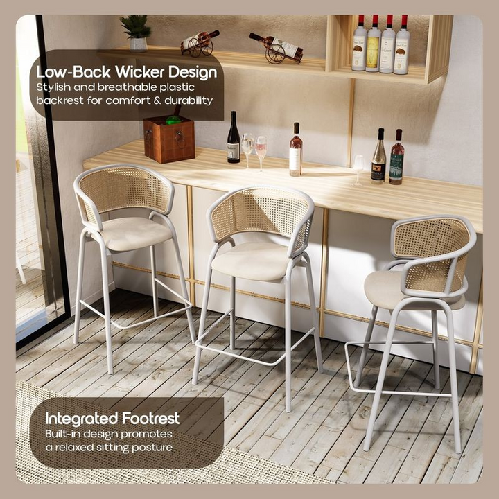 LeisureMod Ervilla Wicker Bar Stool with Fabric Seat and White Steel Frame in White Leather at Bar.