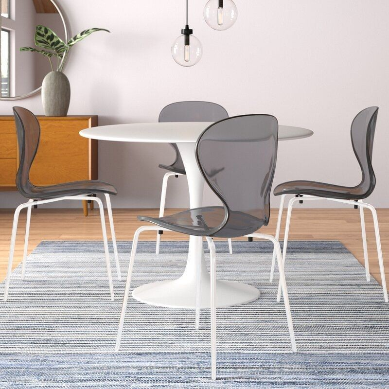 LeisureMod Modern Oyster Transparent Side Chair in White Base Set of 2 Black at Table.