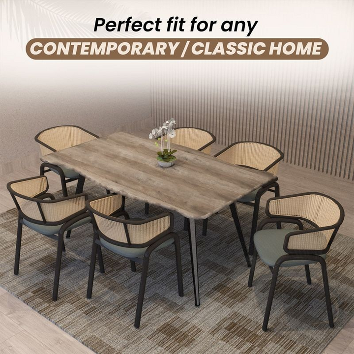 Dining table set with chairs in a room with a neutral color scheme.