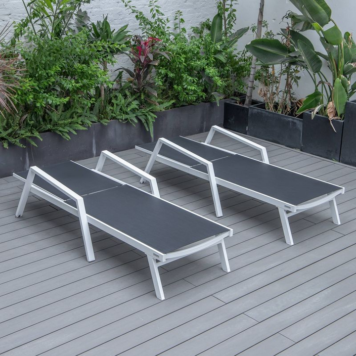 LeisureMod Marlin Patio Chaise Lounge Chair with Armrests in White Aluminum Frame, Set of 2 in Black Flat View.