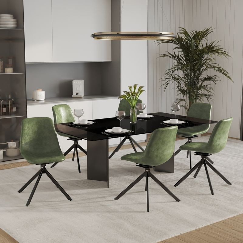 LeisureMod Markley Modern Leather Swivel Dining Chair with Metal Legs in Green at Table.