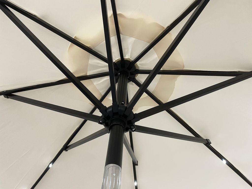 LeisureMod Sierra Outdoor Patio Umbrella with Base in Cream Closeup.