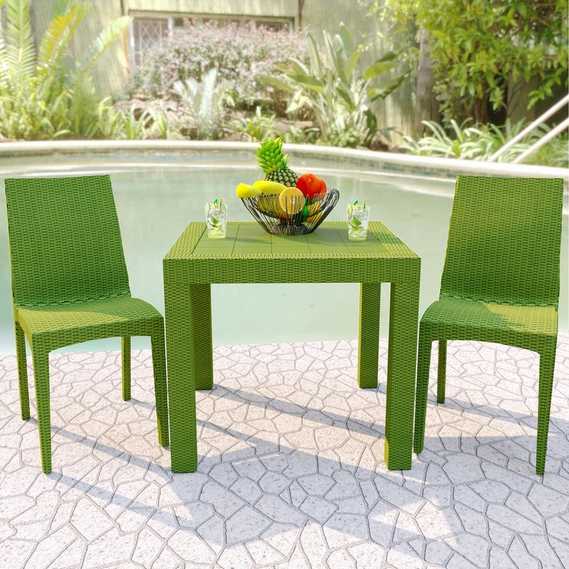 LeisureMod Weave Mace Indoor/Outdoor Dining Chair (Armless) Green at Table.