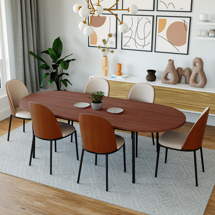 LeisureMod Tule Modern 83" Oval Dining Table with MDF Top and Black Steel Legs in Walnut In Room.