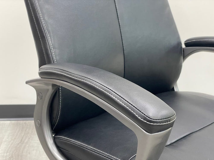 Black Leather High Back Swivel Chair with Charcoal Frame Closeup