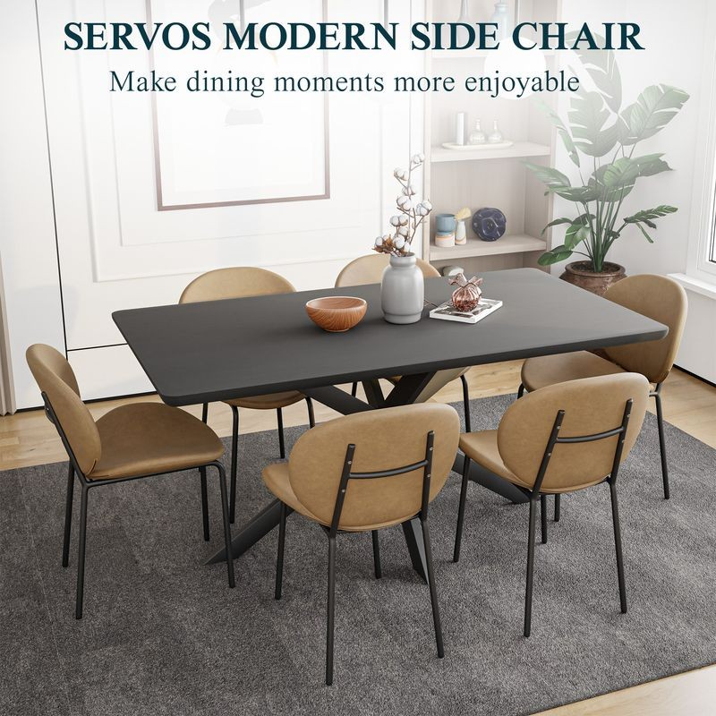 LeisureMod Servos Modern Dining Side Chair with Upholstered Faux Leather Seat and Powder Coated Iron Frame Sand Brown at Table.