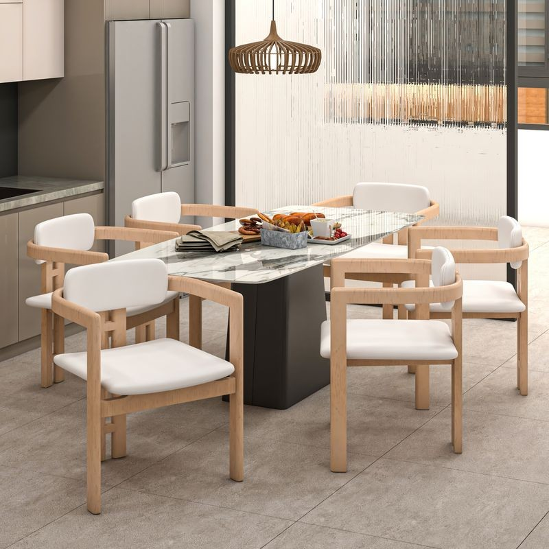 LeisureMod Velo Series Modern Dining Chair in Natural Wood with White Seat at Table.
