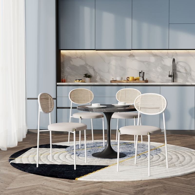 LeisureMod 5-Piece Dining Set with 36" Round Dining Table Black Sintered Stone Top and Black Pedestal with 4 Velvet Dining Chairs in White Steel Legs in Beige in Room.