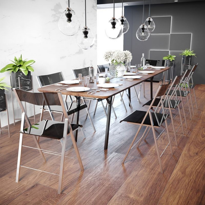 LeisureMod Menno Modern Acrylic Folding Chair Transparent Black at Table.
