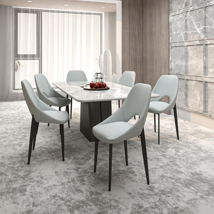 LeisureMod Amalfi Collection Modern Fabric Dining Chair in Coconut White at Table.