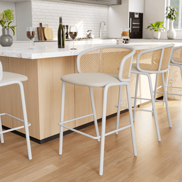 LeisureMod Ervilla Mid-Century Modern Wicker Bar Stool with Fabric Seat and White Powder Coated Steel Frame for Kitchen and Dining Room in Beige at Bar.