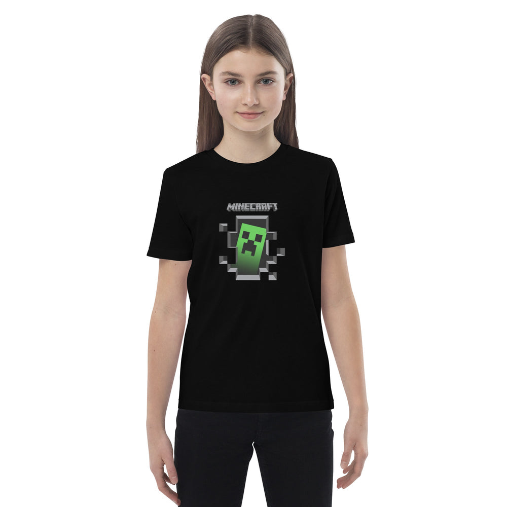 Person wearing a black t-shirt with a Minecraft logo on a white background.