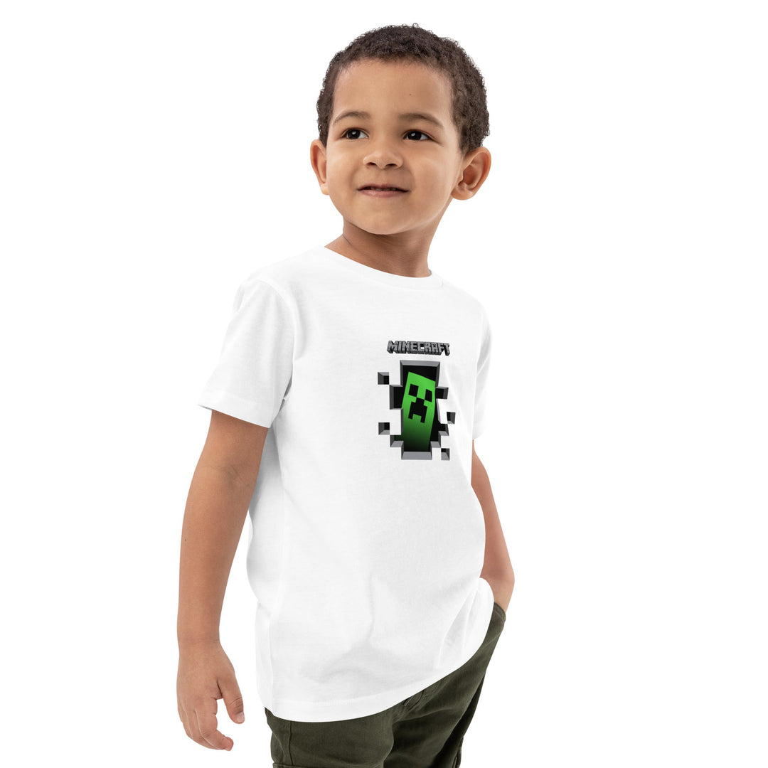 Child wearing a white t-shirt with a Minecraft creeper design on a white background.