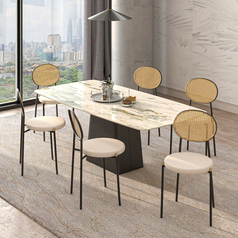 LeisureMod Euston Modern Wicker Dining Chair with Velvet Round Seat Beige at Table.