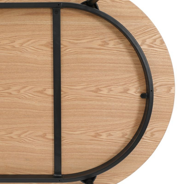 LeisureMod Tule Modern 71" Oval Dining Table with MDF Top and Black Steel Legs in Natural Wood Underneath.
