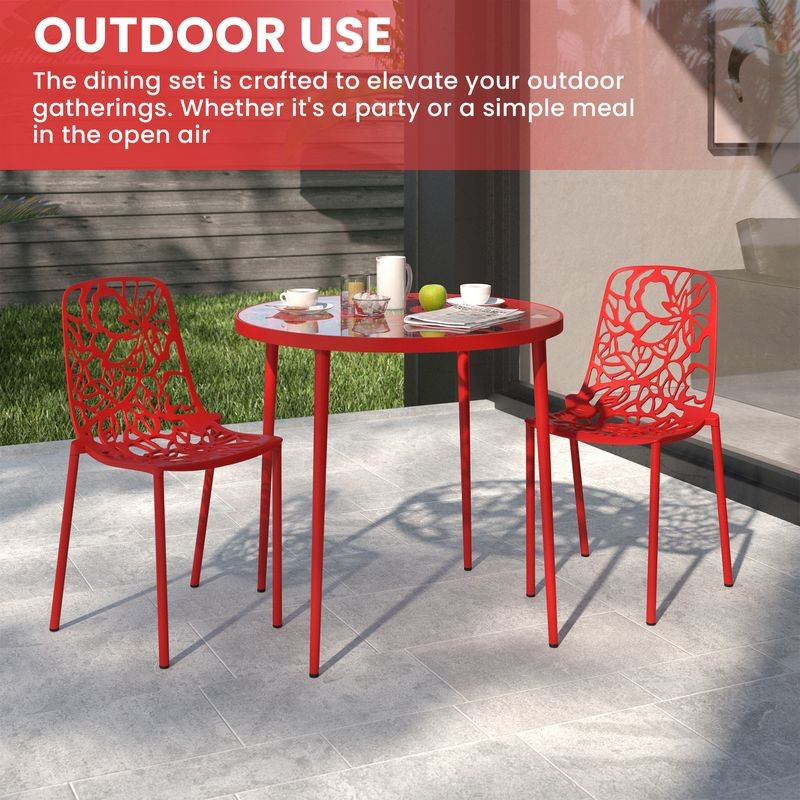 Red outdoor dining set with table and chairs on a patio.