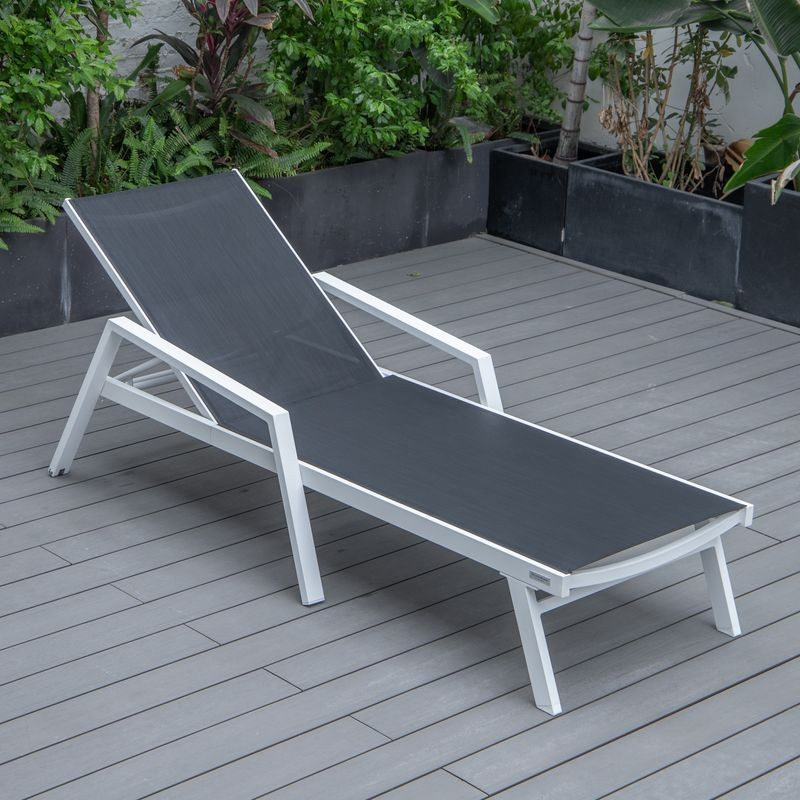 LeisureMod Marlin Patio Chaise Lounge Chair with Armrests in White Aluminum Frame Black Photo.