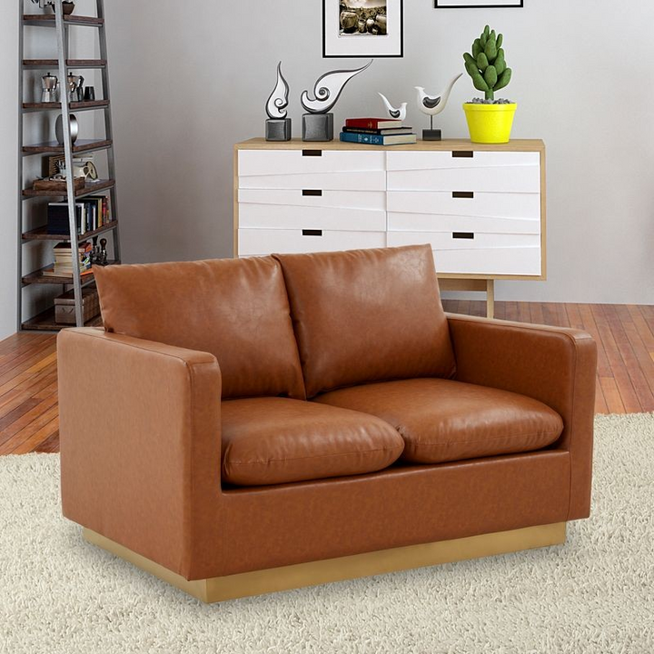 LeisureMod Nervo Modern Mid-Century Upholstered Faux Leather Loveseat with Gold Frame Cognac Tan with Background.