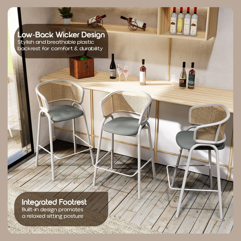 Three bar stools with a wicker design and footrest feature in a casual dining setting.