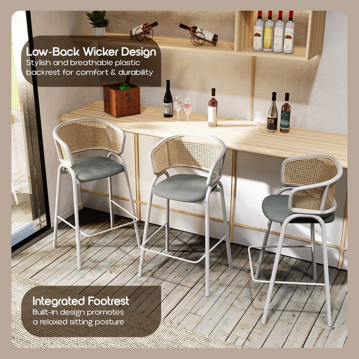 Three bar stools with a wicker design and footrest feature in a casual dining setting.