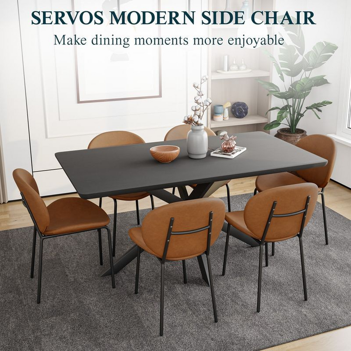 LeisureMod Servos Modern Dining Side Chair with Upholstered Faux Leather Seat and Powder Coated Iron Frame for Kitchen and Dining Room Dark Brown at Table.