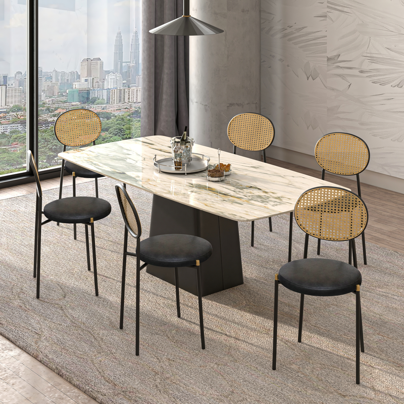 LeisureMod Euston Modern Wicker Dining Chair with Black Frame and Leather Seat in Charcoal at Table.
