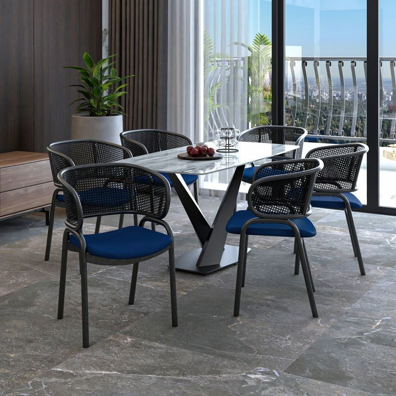 LeisureMod Ervilla Dining Armchair in Black Steel Frame with Black Wicker Back and Navy Blue Seat at Table.
