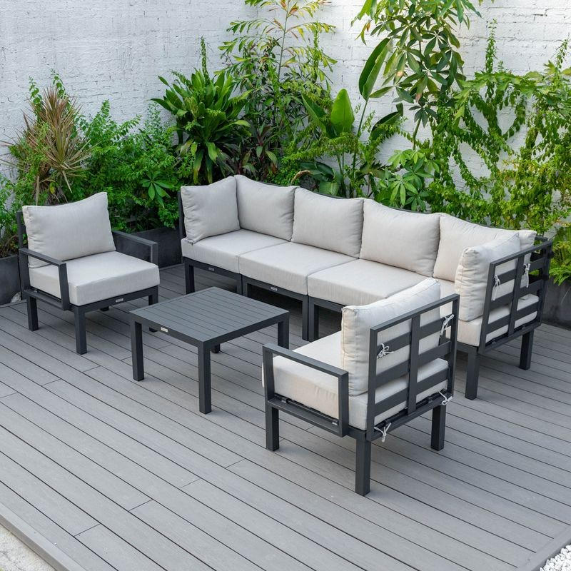 LeisureMod Chelsea 7-Piece Patio Sectional and Coffee Table Set Black Aluminum with Cushions Beige