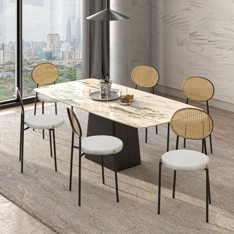 LeisureMod Euston Modern Wicker Dining Chair with Black Frame and Leather Seat in White at Table.