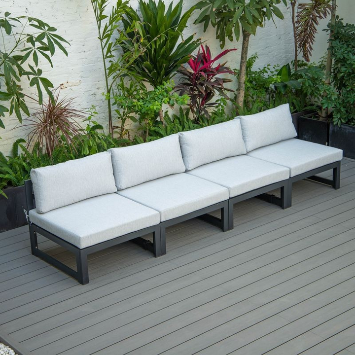 LeisureMod Chelsea 4-Piece Middle Patio Chairs Black Aluminum with Cushions Light Grey on Deck.