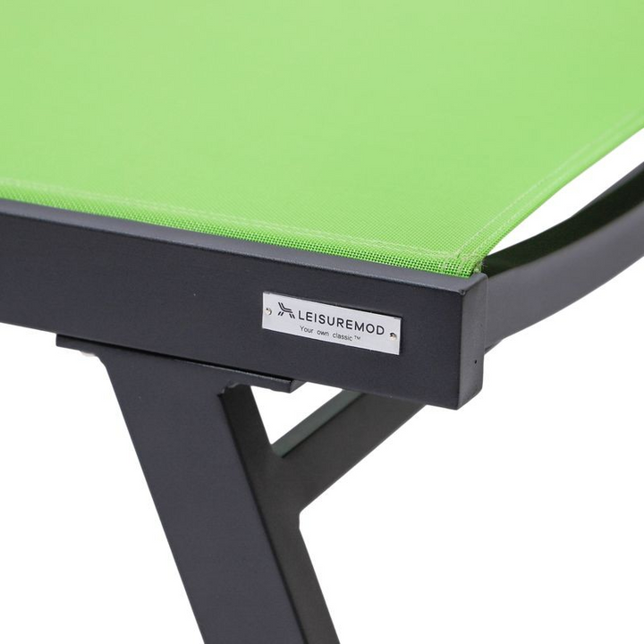 LeisureMod Marlin Patio Chaise Lounge Chair with Armrests in Black Aluminum Frame Green Closeup.