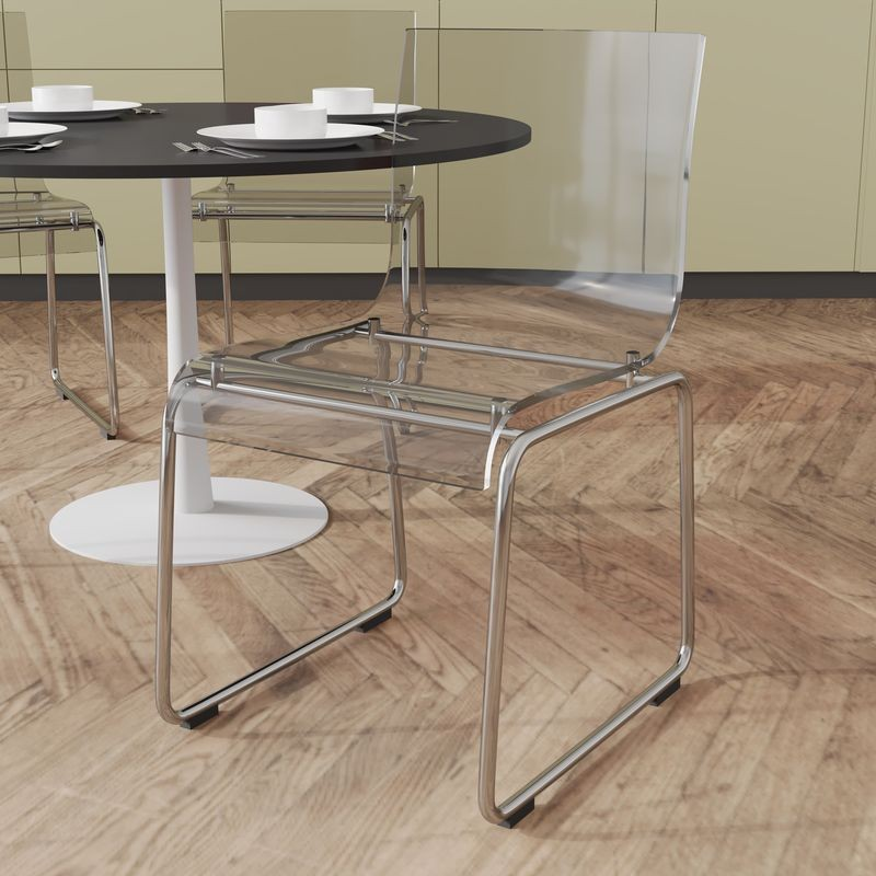 LeisureMod Lima Modern Acrylic Chair Clear at Table.