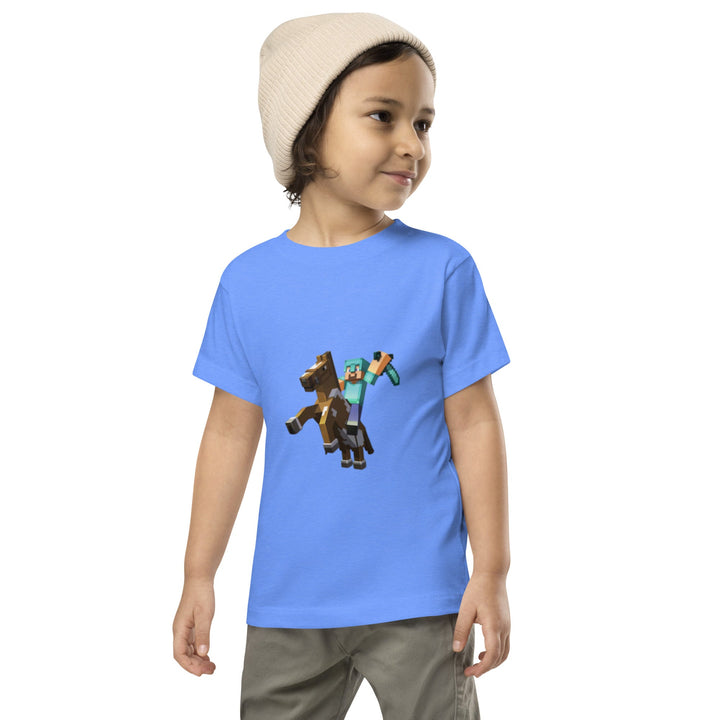 Child wearing a blue t-shirt with a character design on a white background.