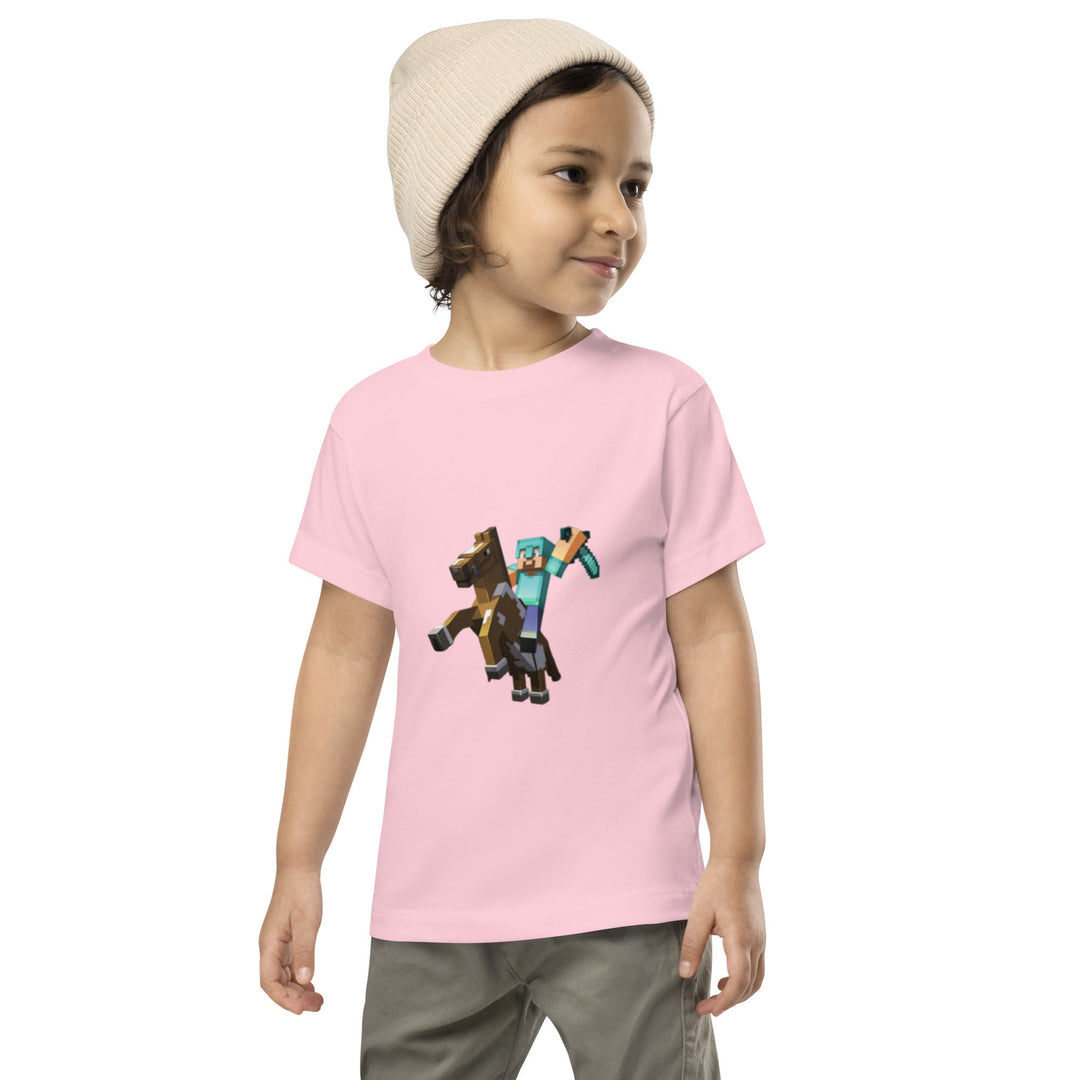 Child wearing a pink t-shirt with a graphic design on a white background.
