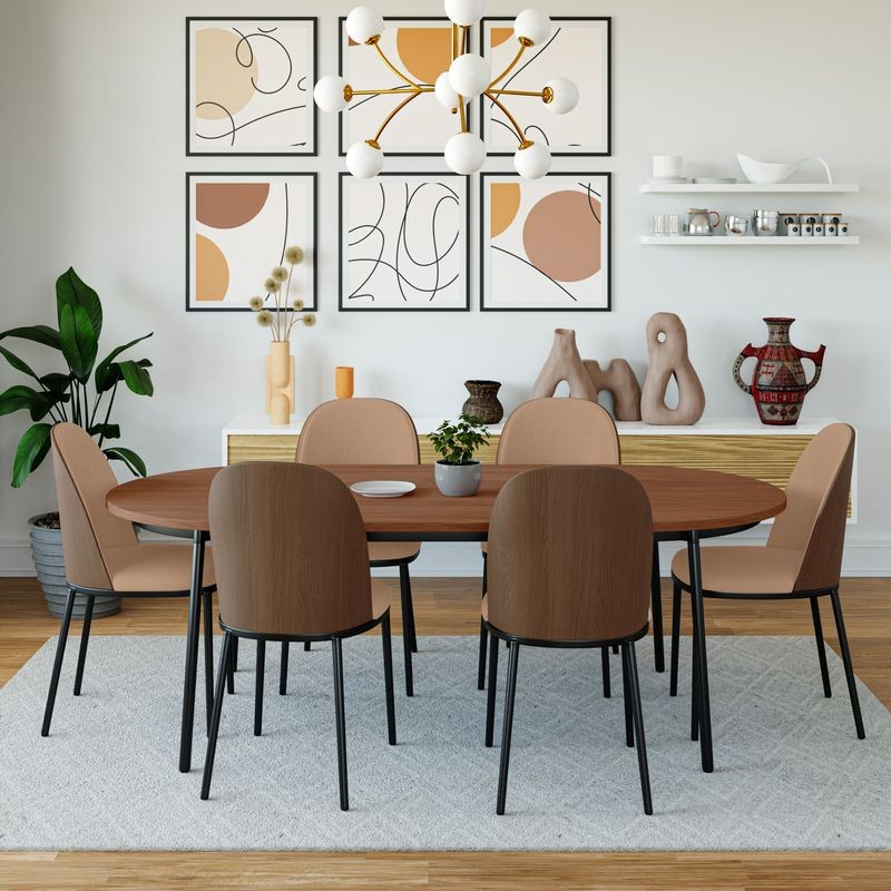 Dining room with wooden table and chairs, abstract art on the wall, and decorative items.