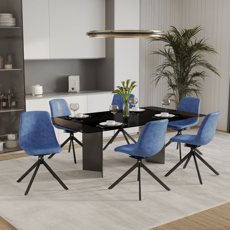 LeisureMod Markley Modern Leather Swivel Dining Chair With Metal Legs in Blue with Background. at Table.
