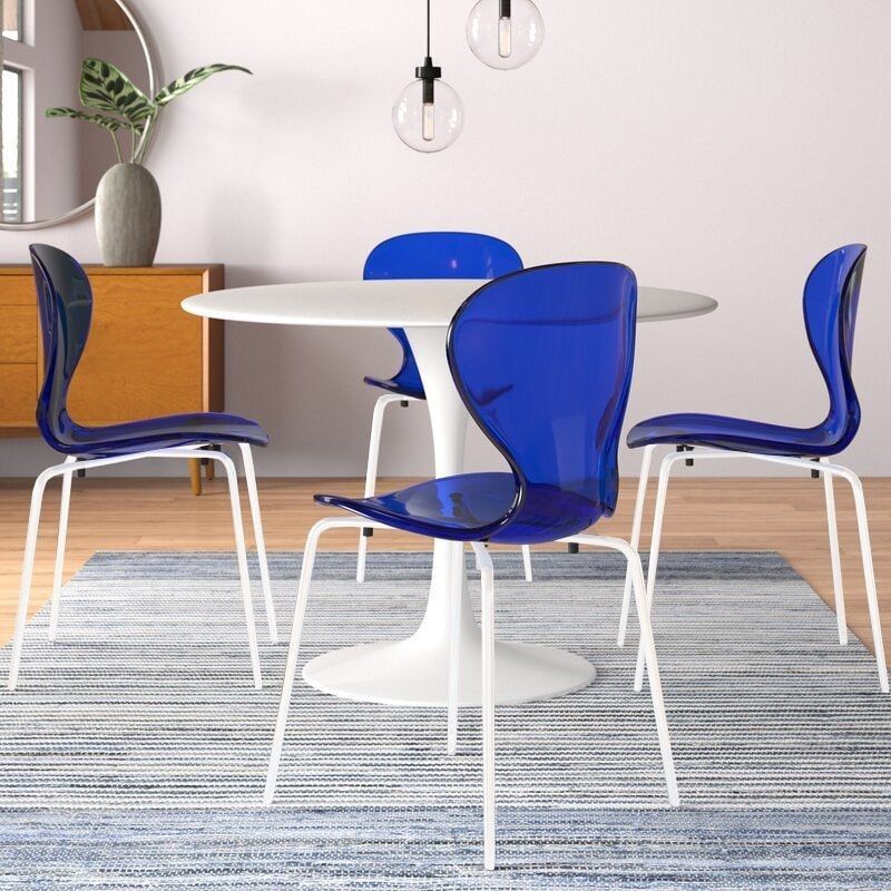 LeisureMod Modern Oyster Transparent Side Chair in White Base Set of 2 Blue at Table.