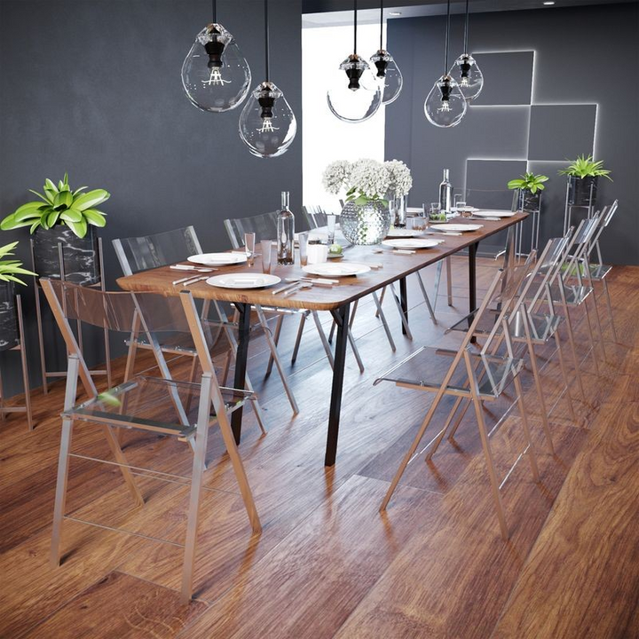 LeisureMod Menno Modern Acrylic Folding Chair at Table.