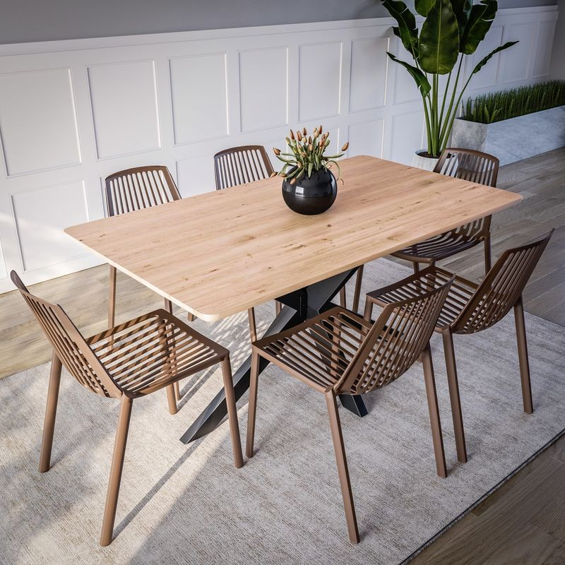 LeisureMod Acken Plastic Stackable Dining Chair Taupe at Table.