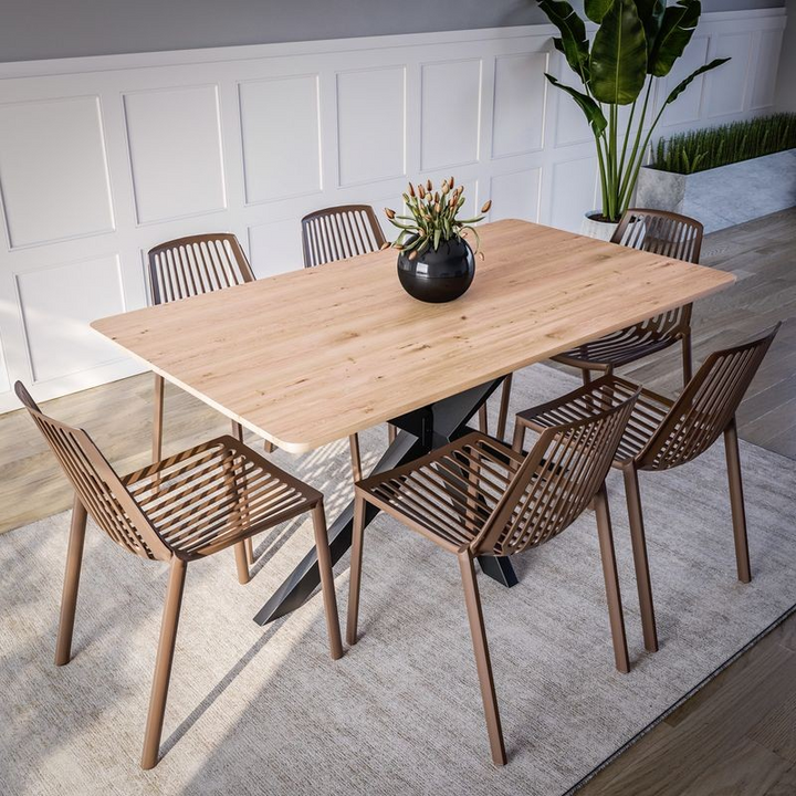 LeisureMod Acken Plastic Stackable Dining Chair Taupe at Table.