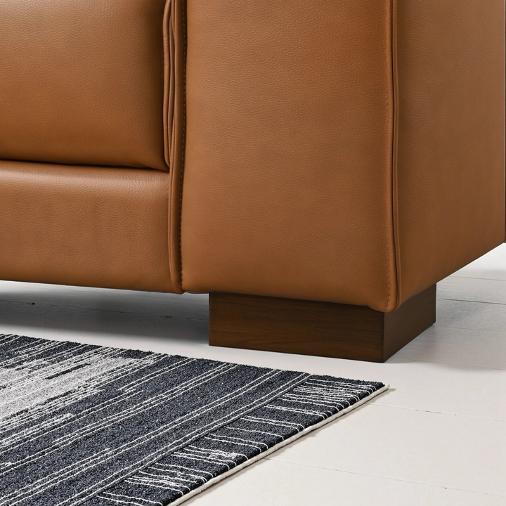 Muncie L-Shaped Sofa with Plush Cushions and Walnut Wood Legs Closeup.