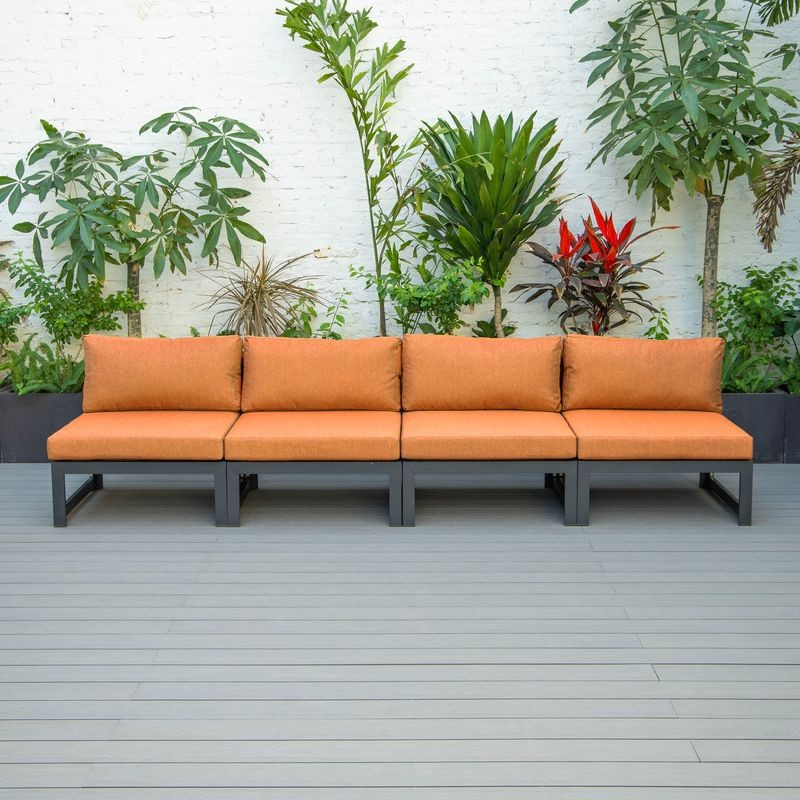 LeisureMod Chelsea 4-Piece Middle Patio Chairs Black Aluminum with Cushions Orange in a Row.