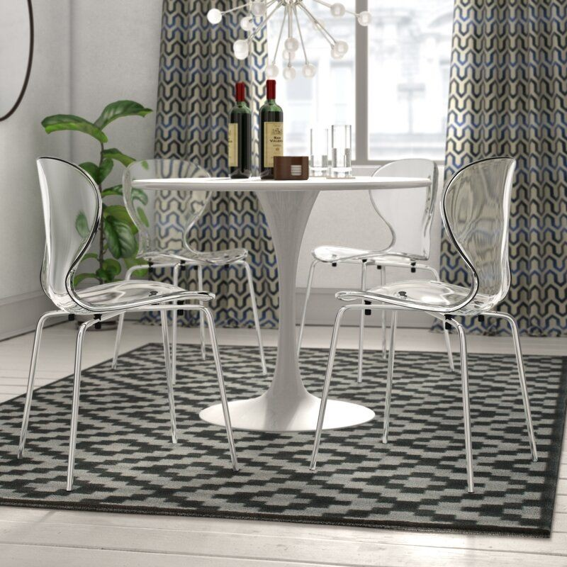 LeisureMod Modern Oyster Transparent Side Chair Clear at Table.